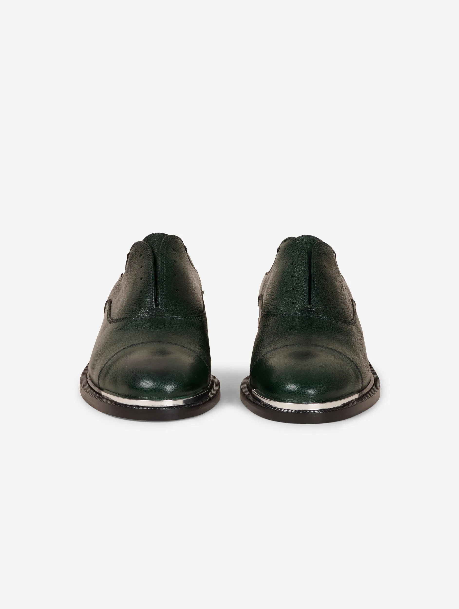 Derbies in green leather